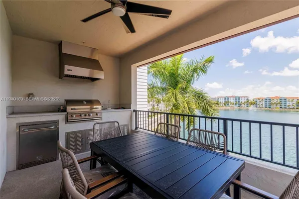 a dining room with furniture a floor to ceiling window and a ceiling fan