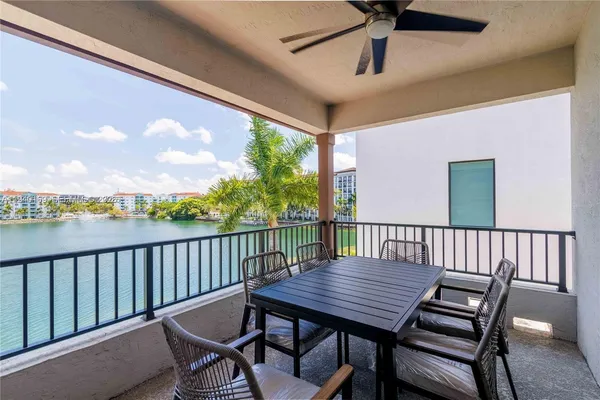a view of a balcony with furniture