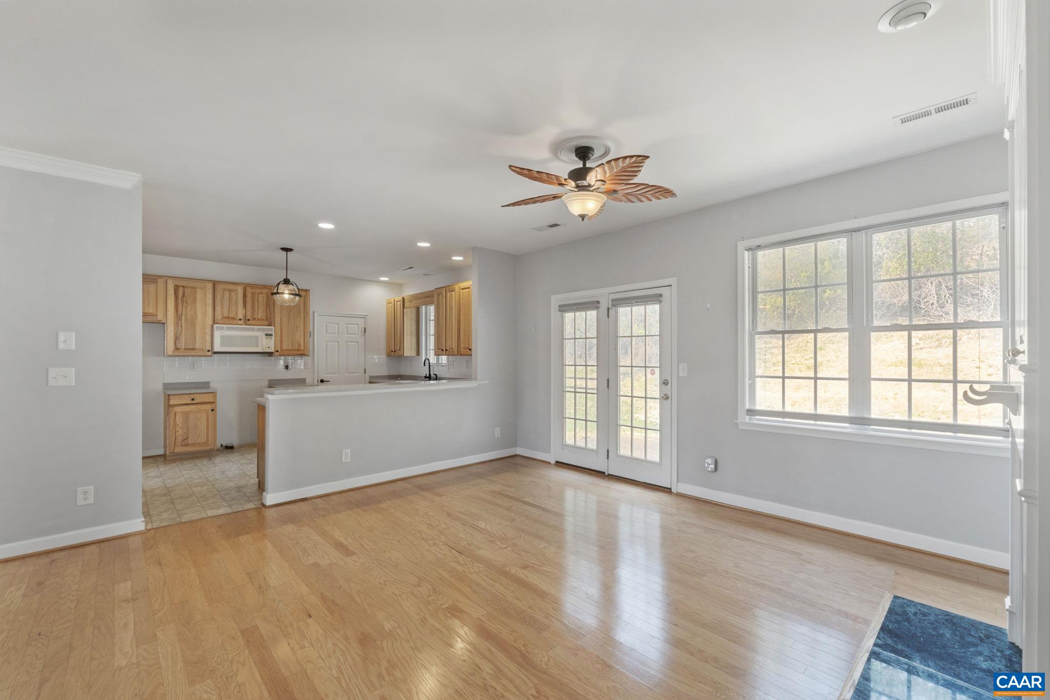 1118 Rustic Willow Lane Charlottesville, VA 22911 - Photo 16 of 33 a view of an empty room with a window and wooden floor
