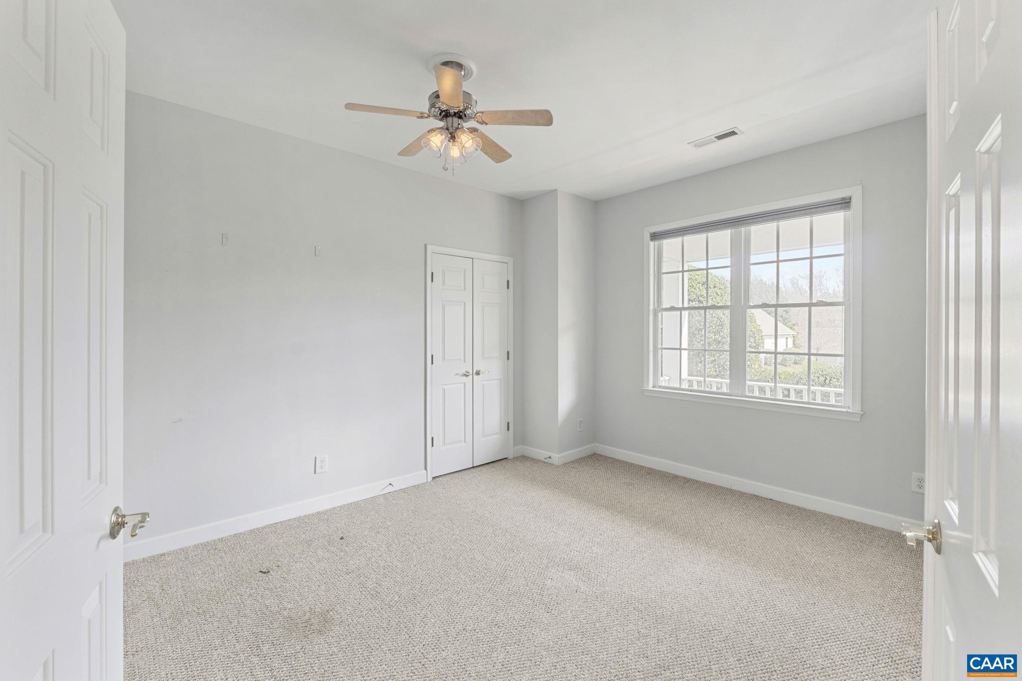 1118 Rustic Willow Lane Charlottesville, VA 22911 - Photo 19 of 33 an empty room with windows and fan