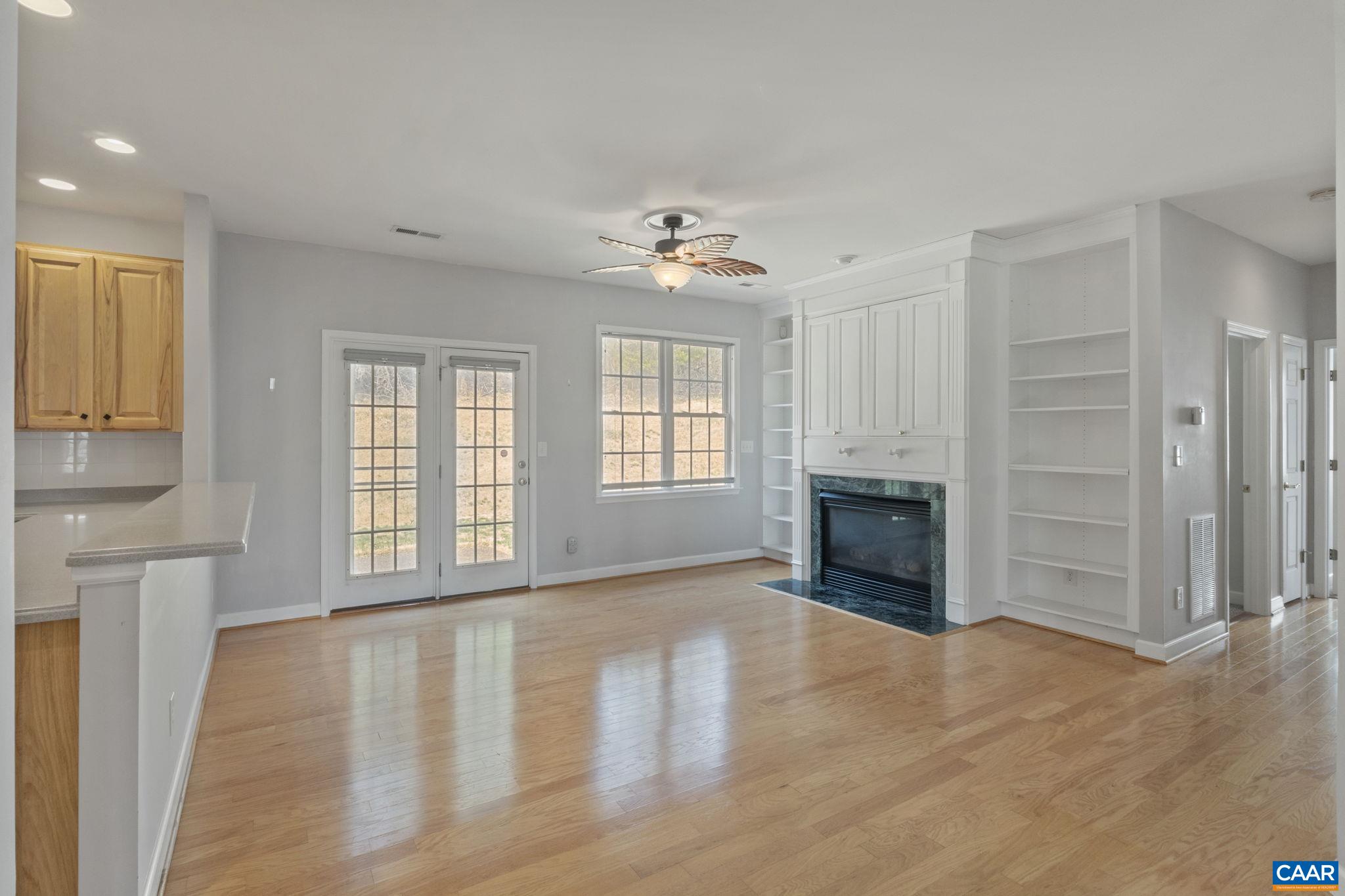 1118 Rustic Willow Lane Charlottesville, VA 22911 - Photo 3 of 33 an empty room with windows and a fireplace