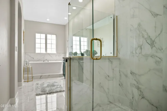 a view of washer and dryer with kitchen in the background