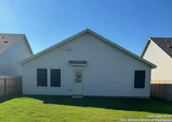 a view of a backyard of the house