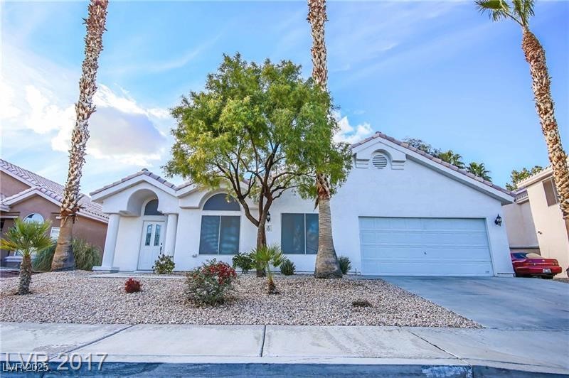 315 Modesto Street Henderson, NV 89014 - Photo 3 of 22 This is what it looked like before the tree became overgrown!