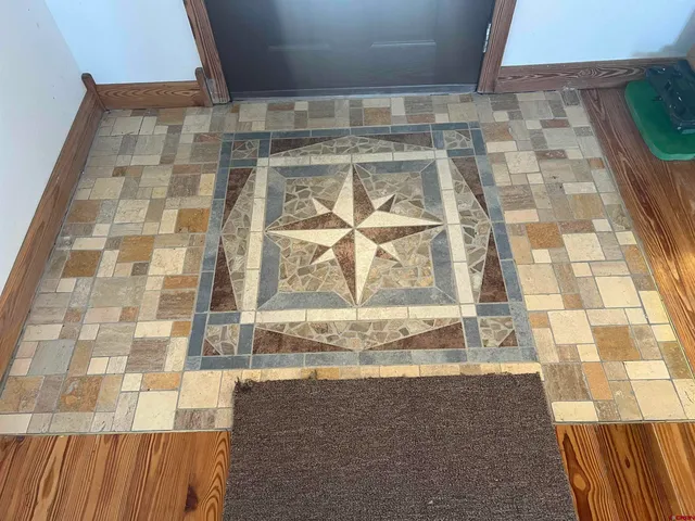 a view of a livingroom with furniture nad wooden floor