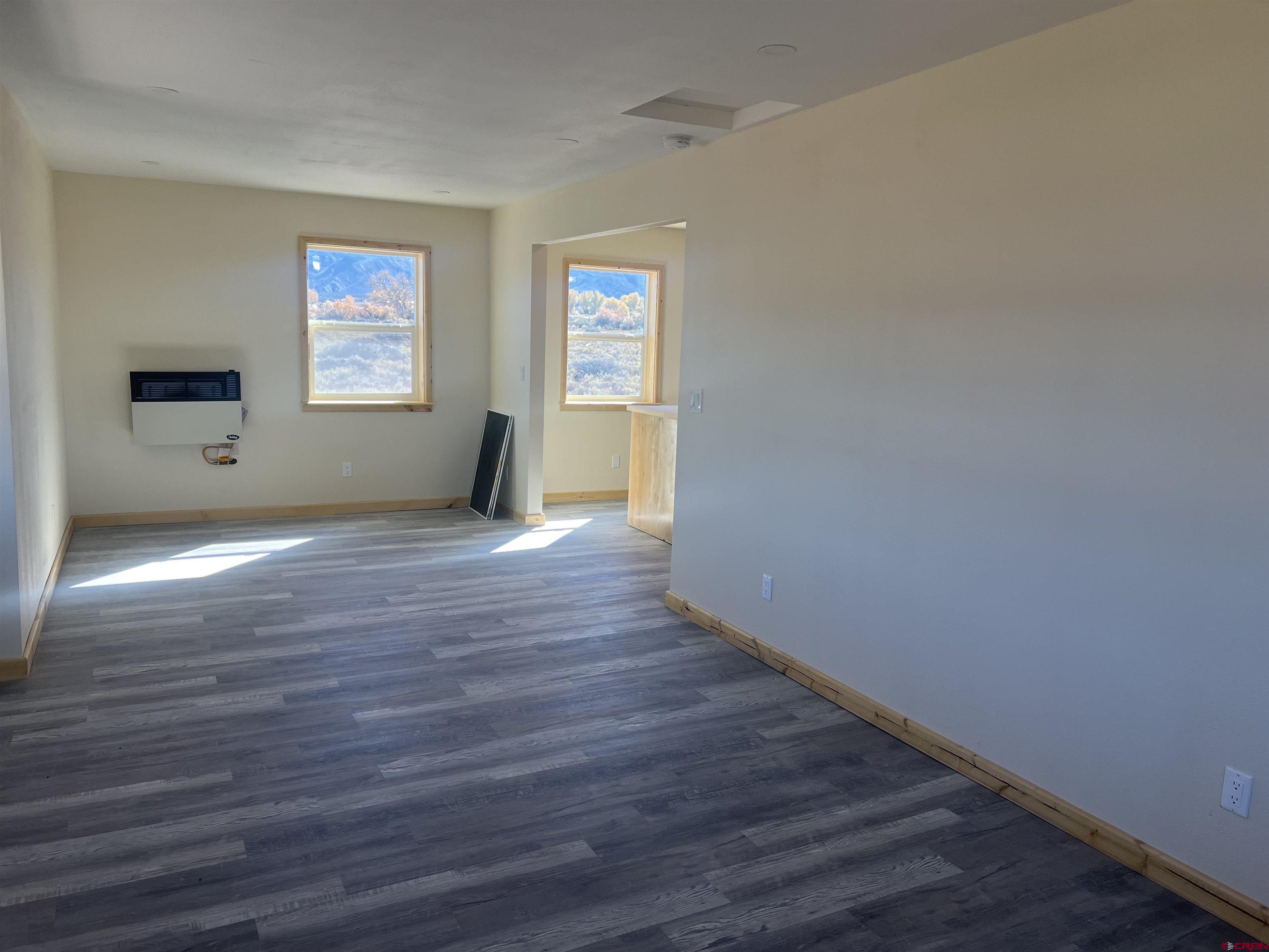 8504 Road 27 Cortez, CO 81321 - Photo 17 of 43 a view of empty room with wooden floor and fan