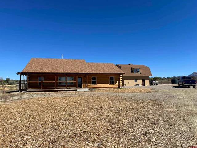 a house with trees in the background
