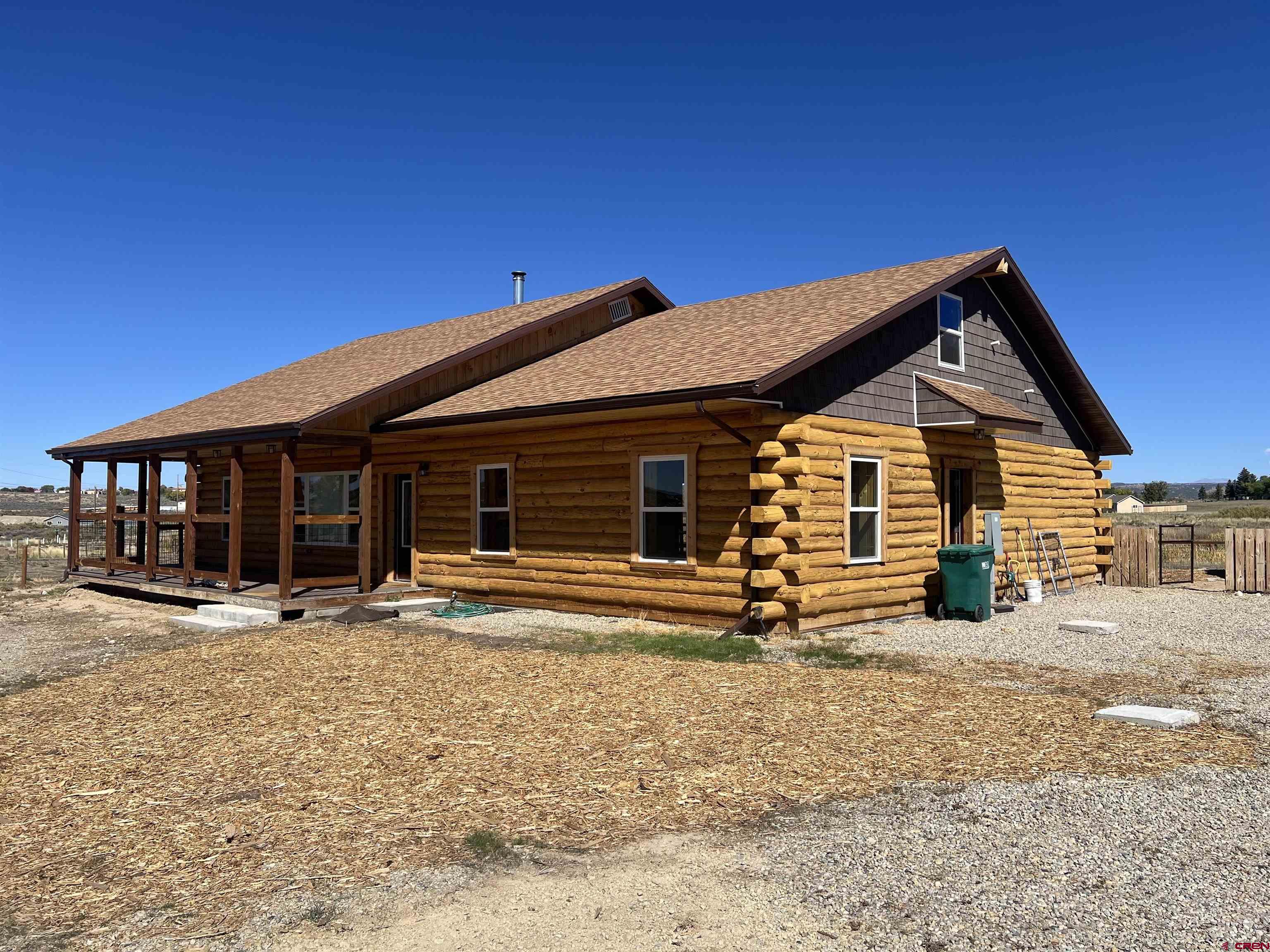 8504 Road 27 Cortez, CO 81321 - Photo 23 of 43 a front view of a house with a yard