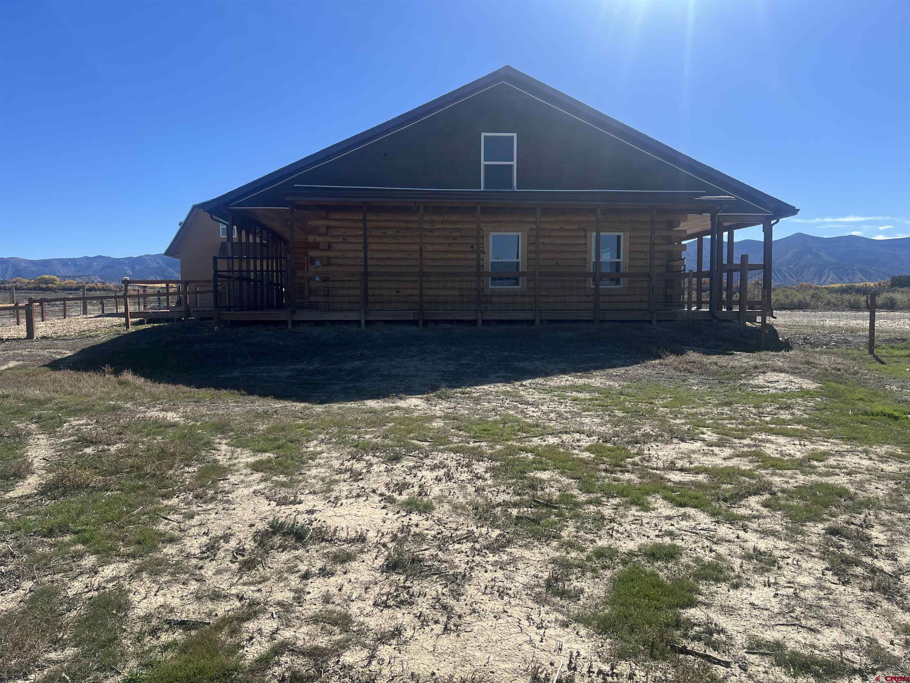 8504 Road 27 Cortez, CO 81321 - Photo 25 of 43 a front view of a house with a yard
