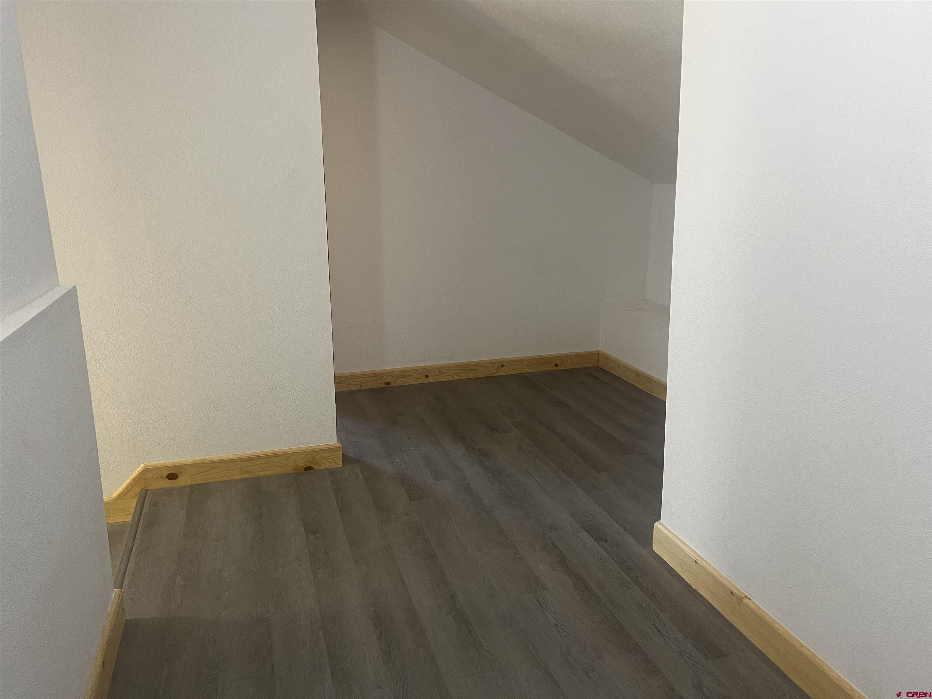 8504 Road 27 Cortez, CO 81321 - Photo 36 of 43 a view of an empty room with wooden floor