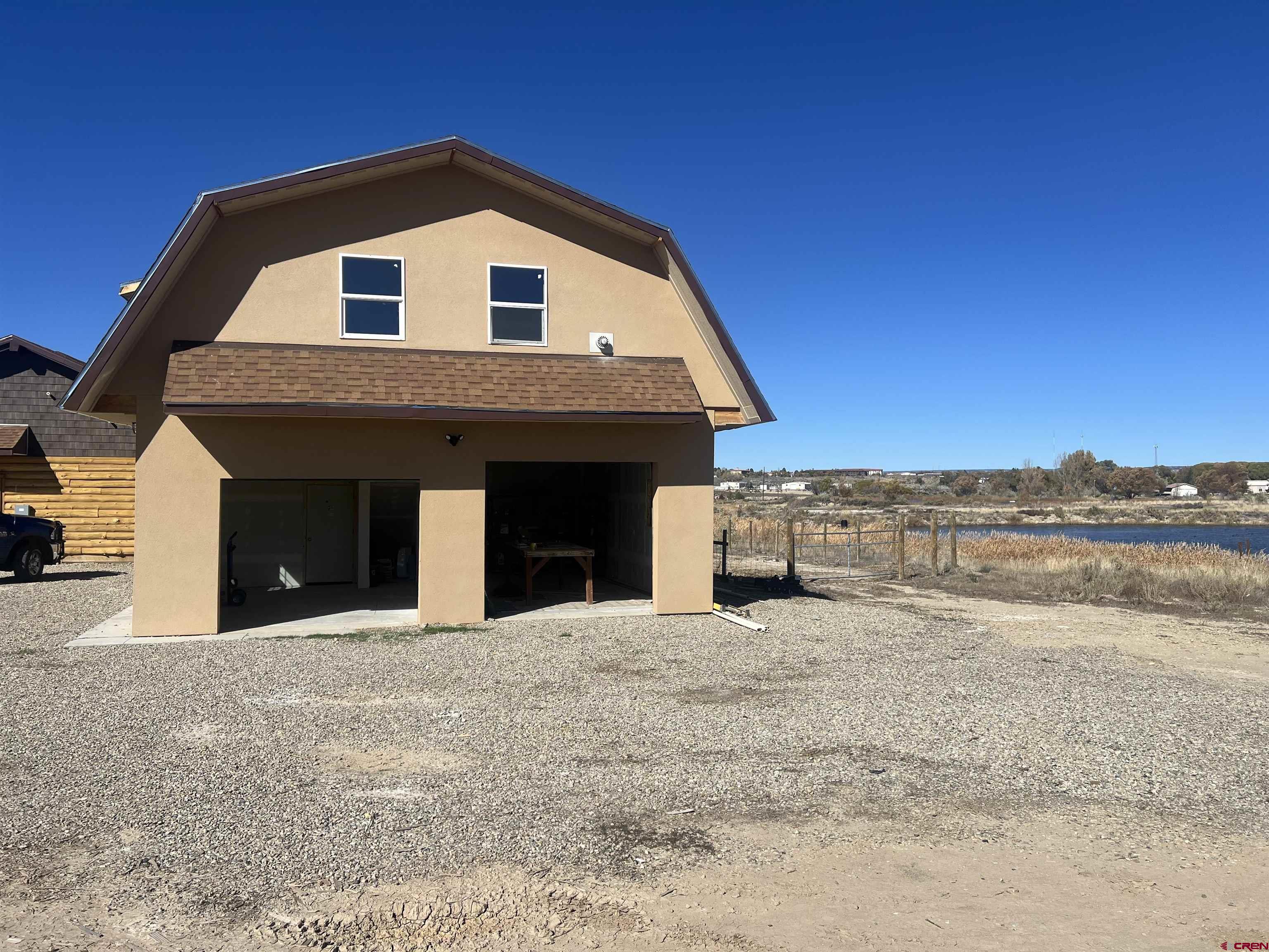 8504 Road 27 Cortez, CO 81321 - Photo 38 of 43 a front view of a house with a yard