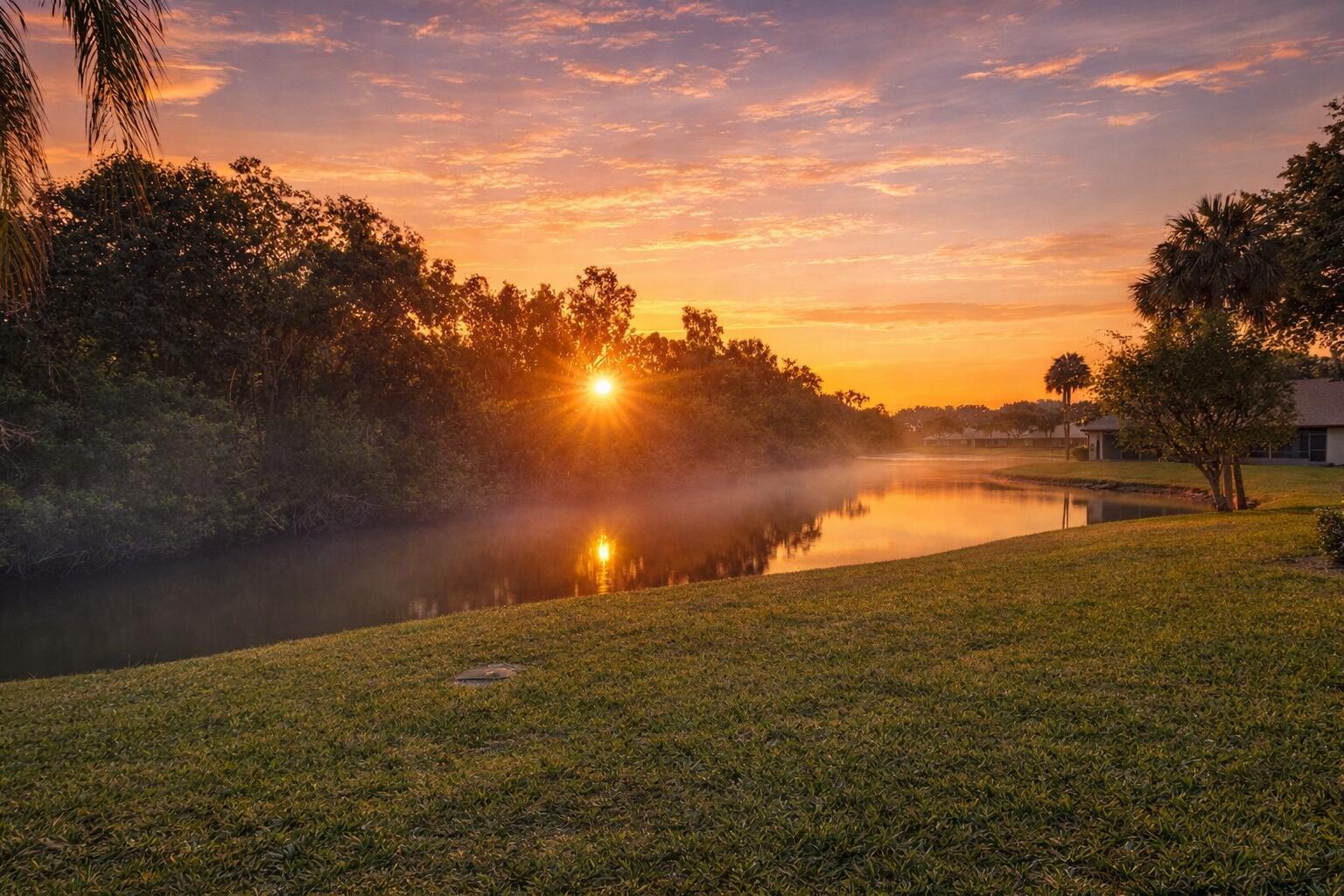 8299 Boca Glades Boulevard East Boca Raton, FL 33434 - Photo 3 of 67 Serene sunrise over tranquil waters