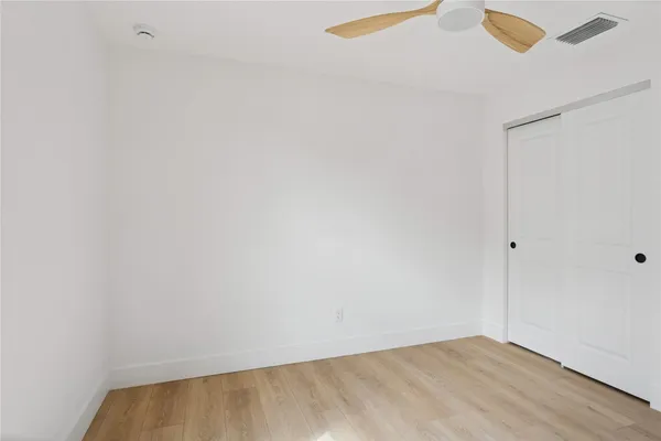 a view of a house next to a big yard