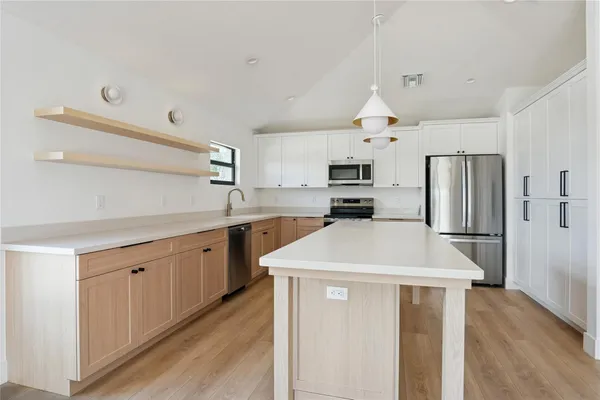 a kitchen with a sink and a window