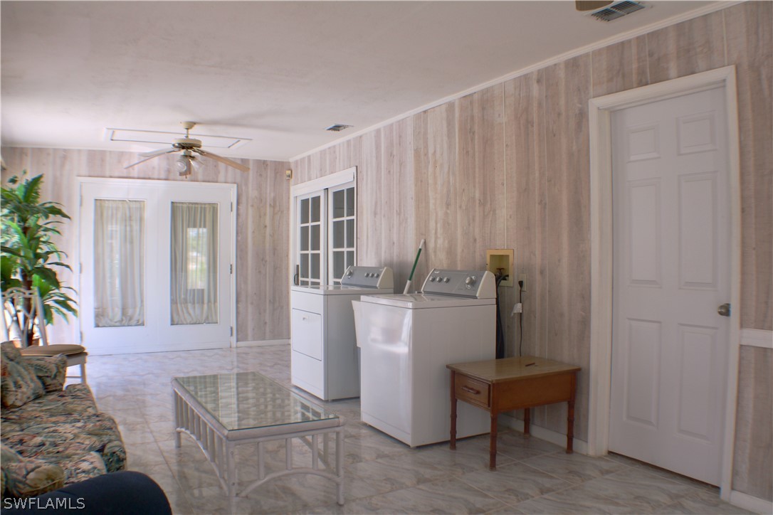 12210 Shawnee Road Fort Myers, FL 33913 - Photo 16 of 28 a living room with furniture and a table