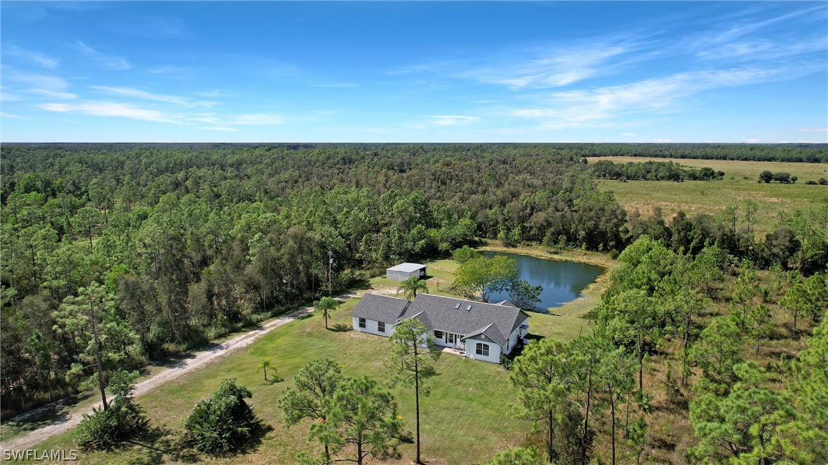 12210 Shawnee Road Fort Myers, FL 33913 - Photo 25 of 28 an aerial view of a house with ocean view