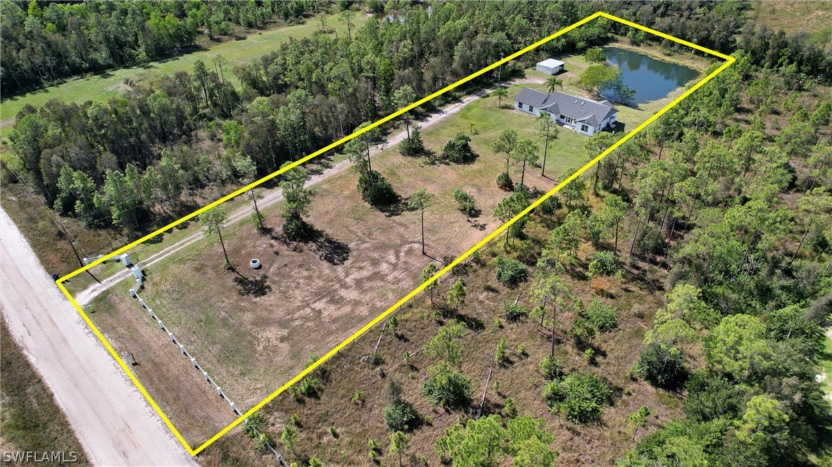12210 Shawnee Road Fort Myers, FL 33913 - Photo 26 of 28 a view of a house with a small yard