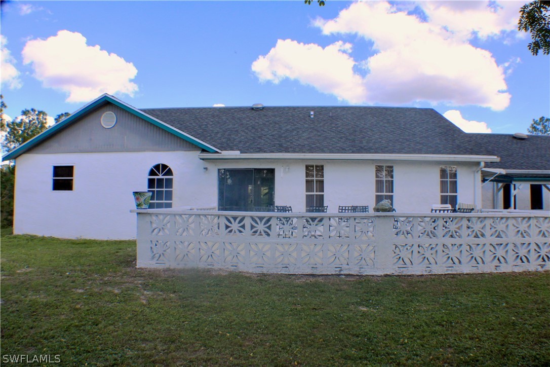 12210 Shawnee Road Fort Myers, FL 33913 - Photo 5 of 28 a view of a house with a yard