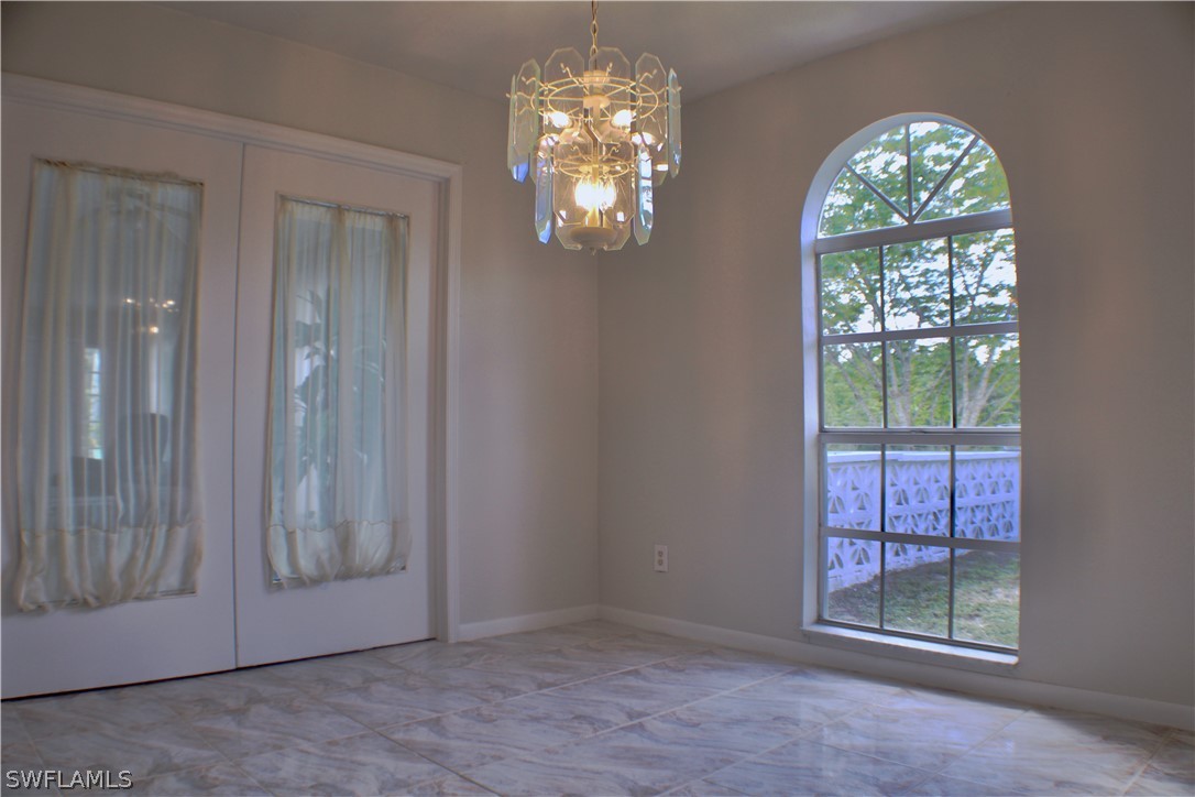 12210 Shawnee Road Fort Myers, FL 33913 - Photo 7 of 28 en view of an empty room with window