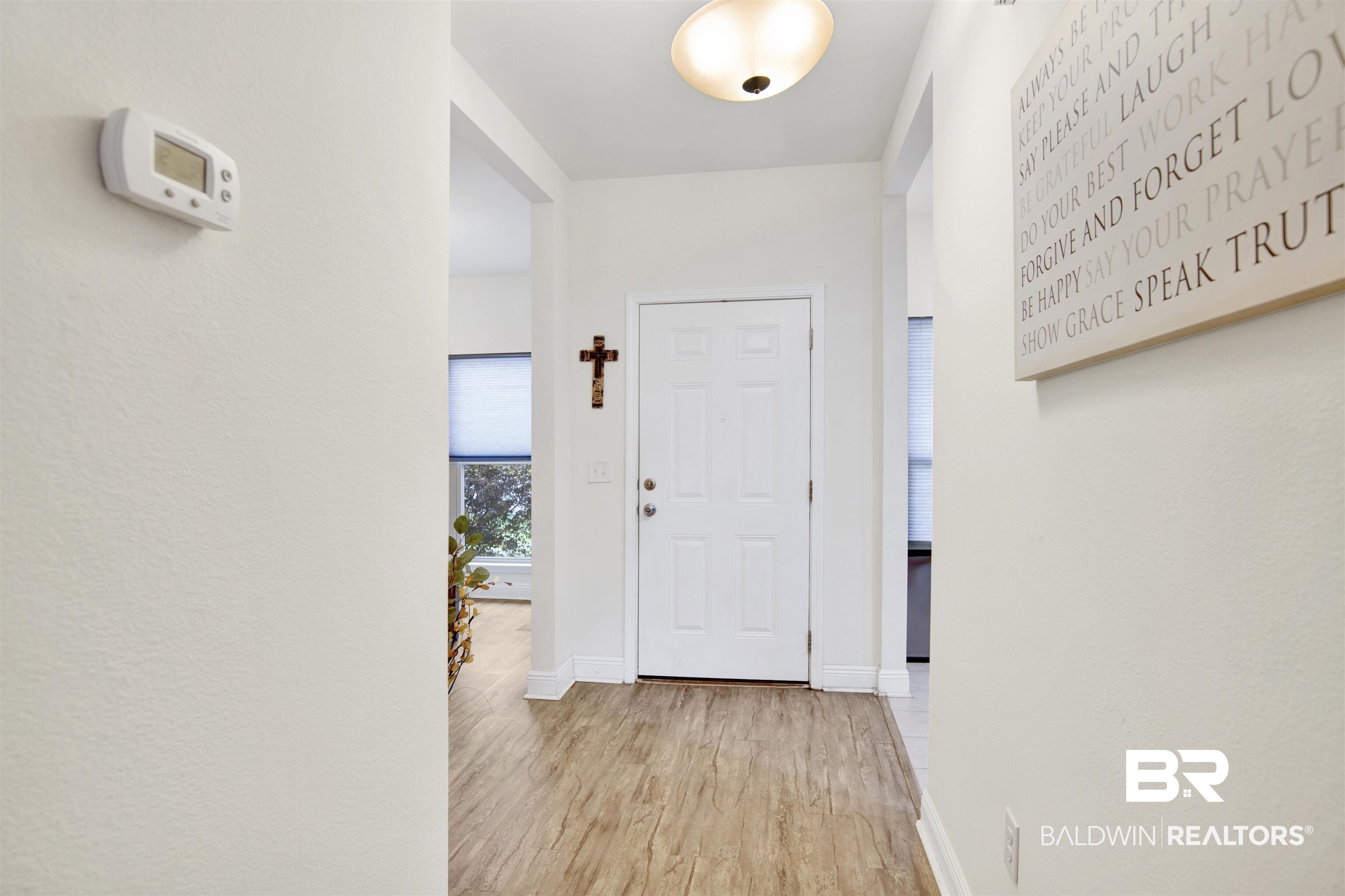 1468 Surrey Loop Foley, AL 36535 - Photo 3 of 28 Foyer entrance with wood finished floors and baseboards
