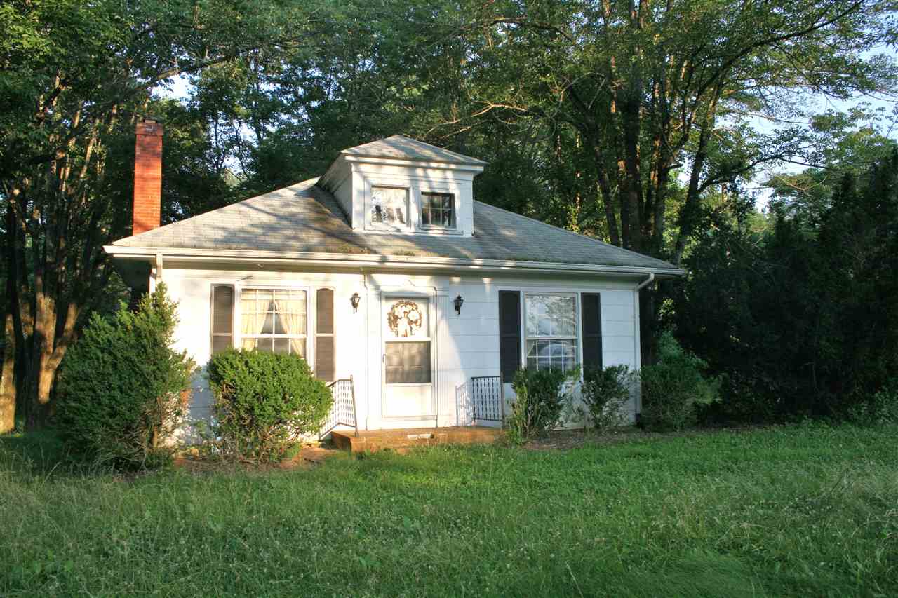 130 Bibb Store Road Louisa, VA 23093 - Photo 1 of 15 a front view of a house with a garden