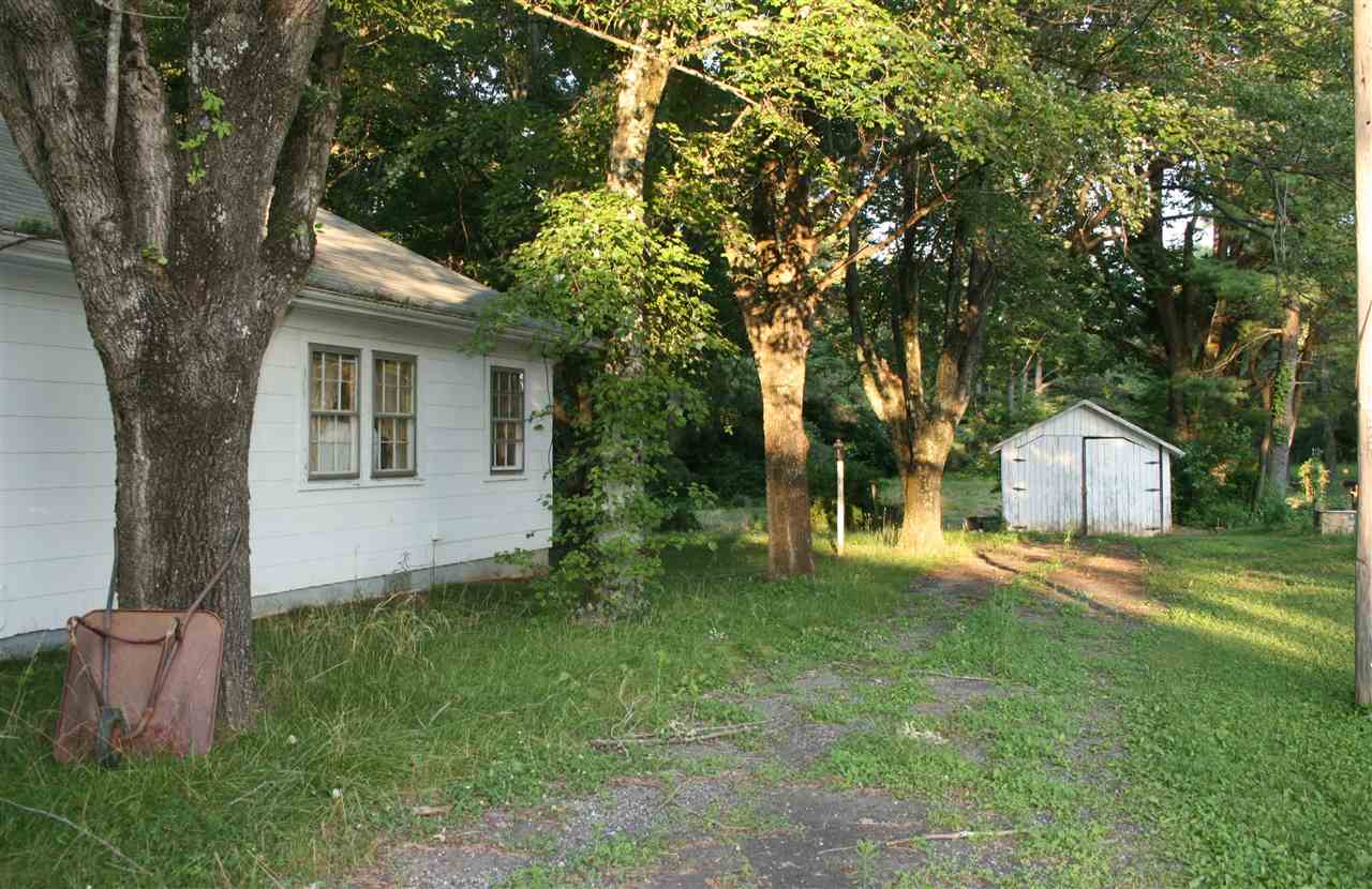 130 Bibb Store Road Louisa, VA 23093 - Photo 2 of 15 a front view of a house with a yard and trees