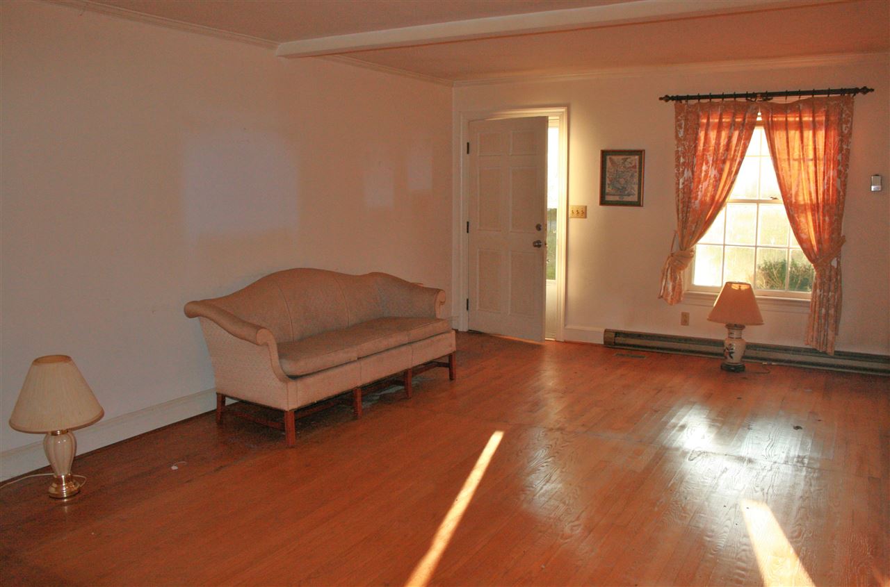 130 Bibb Store Road Louisa, VA 23093 - Photo 7 of 15 a living room with hard wood floors and a couch
