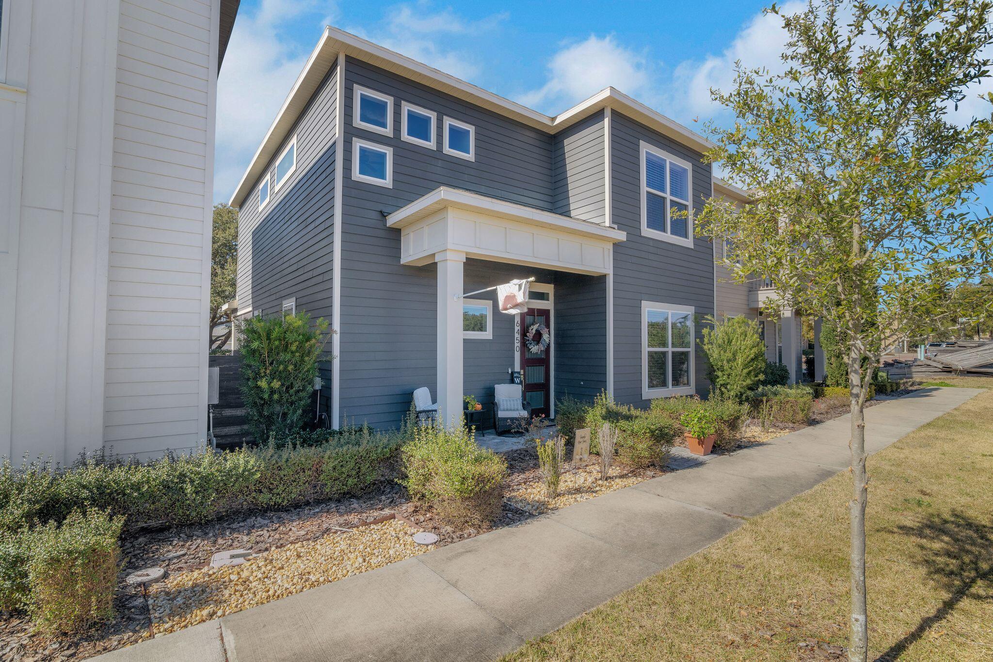 a front view of a house with garden