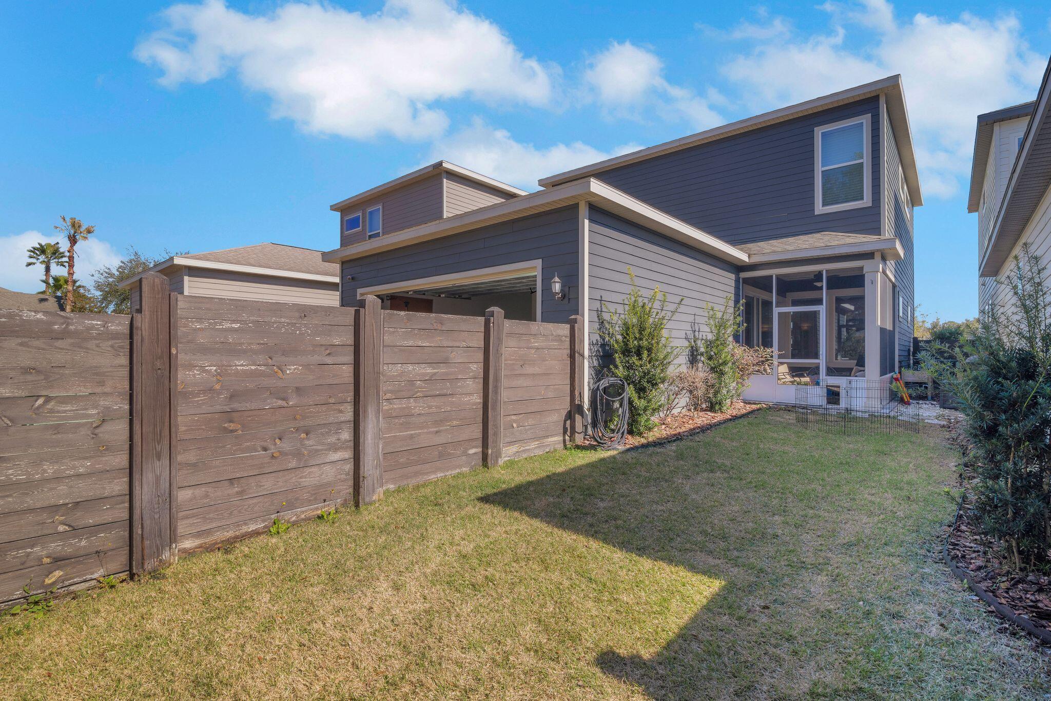 6450 Southwest 77th Street Gainesville, FL 32608 - Photo 3 of 30 a view of a house with a backyard