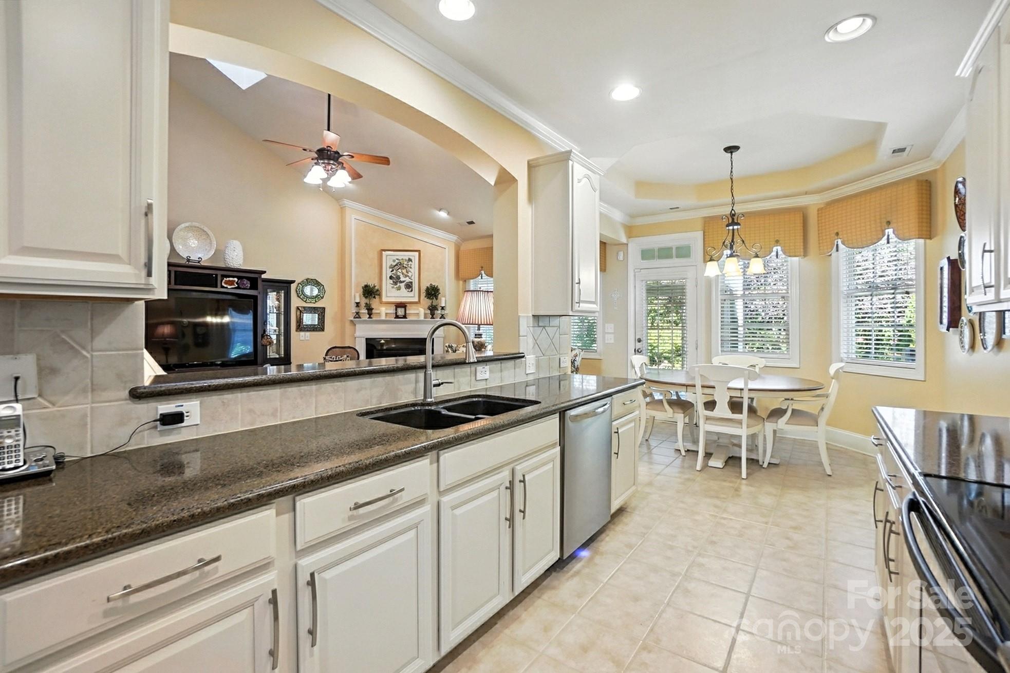 10906 Round Rock Road Charlotte, NC 28277 - Photo 11 of 45 a large kitchen with cabinets