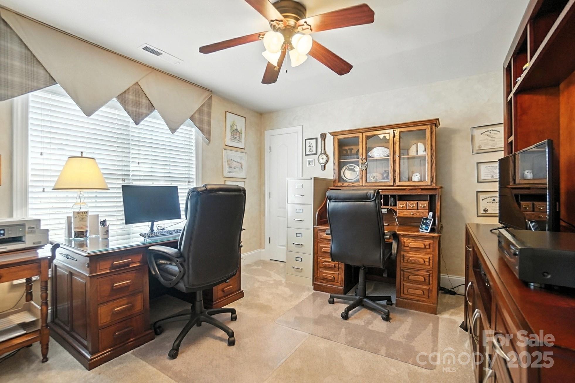 10906 Round Rock Road Charlotte, NC 28277 - Photo 34 of 45 a view of a workspace with furniture and a window