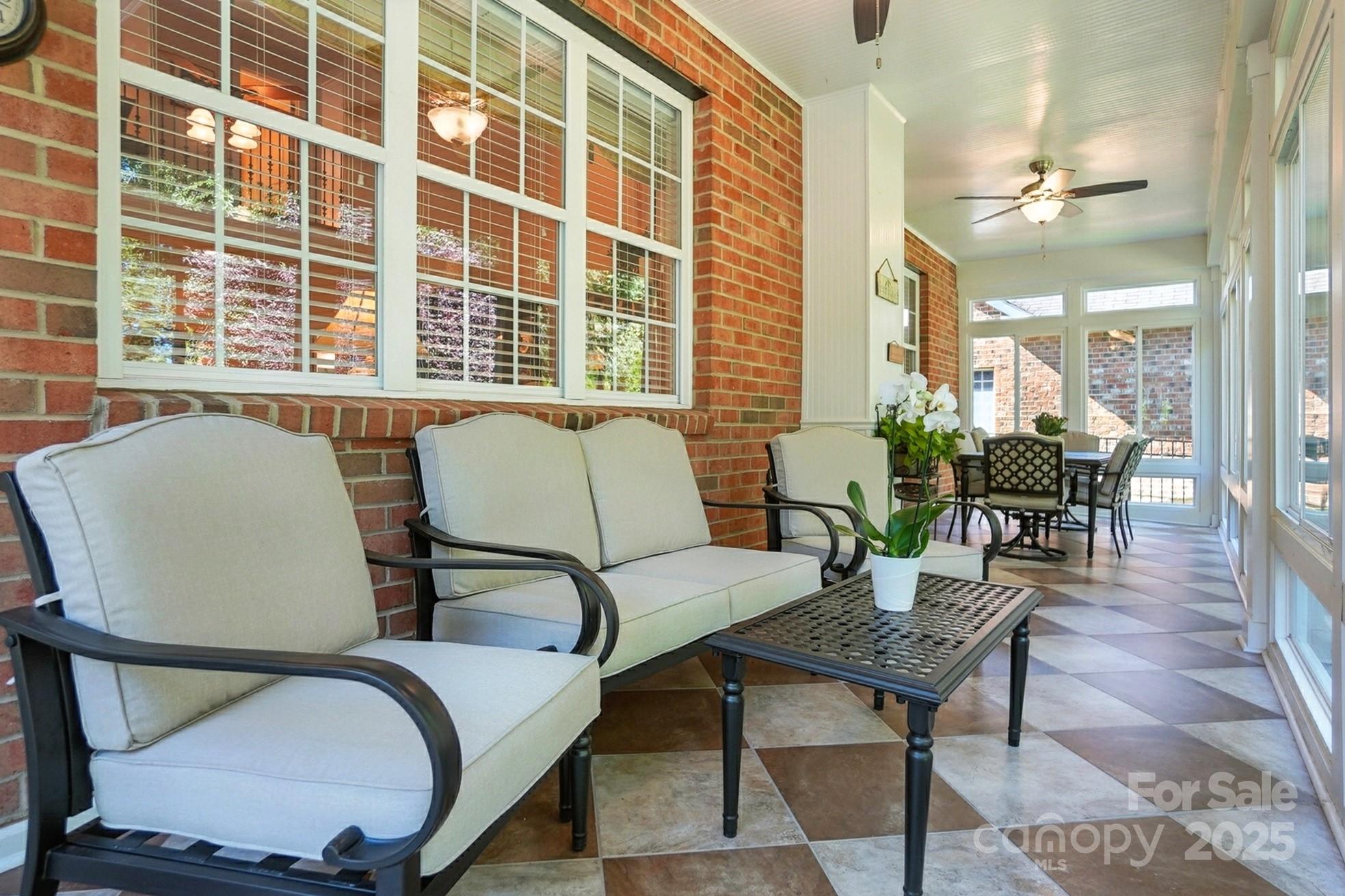 10906 Round Rock Road Charlotte, NC 28277 - Photo 36 of 45 a living room with furniture and a potted plant