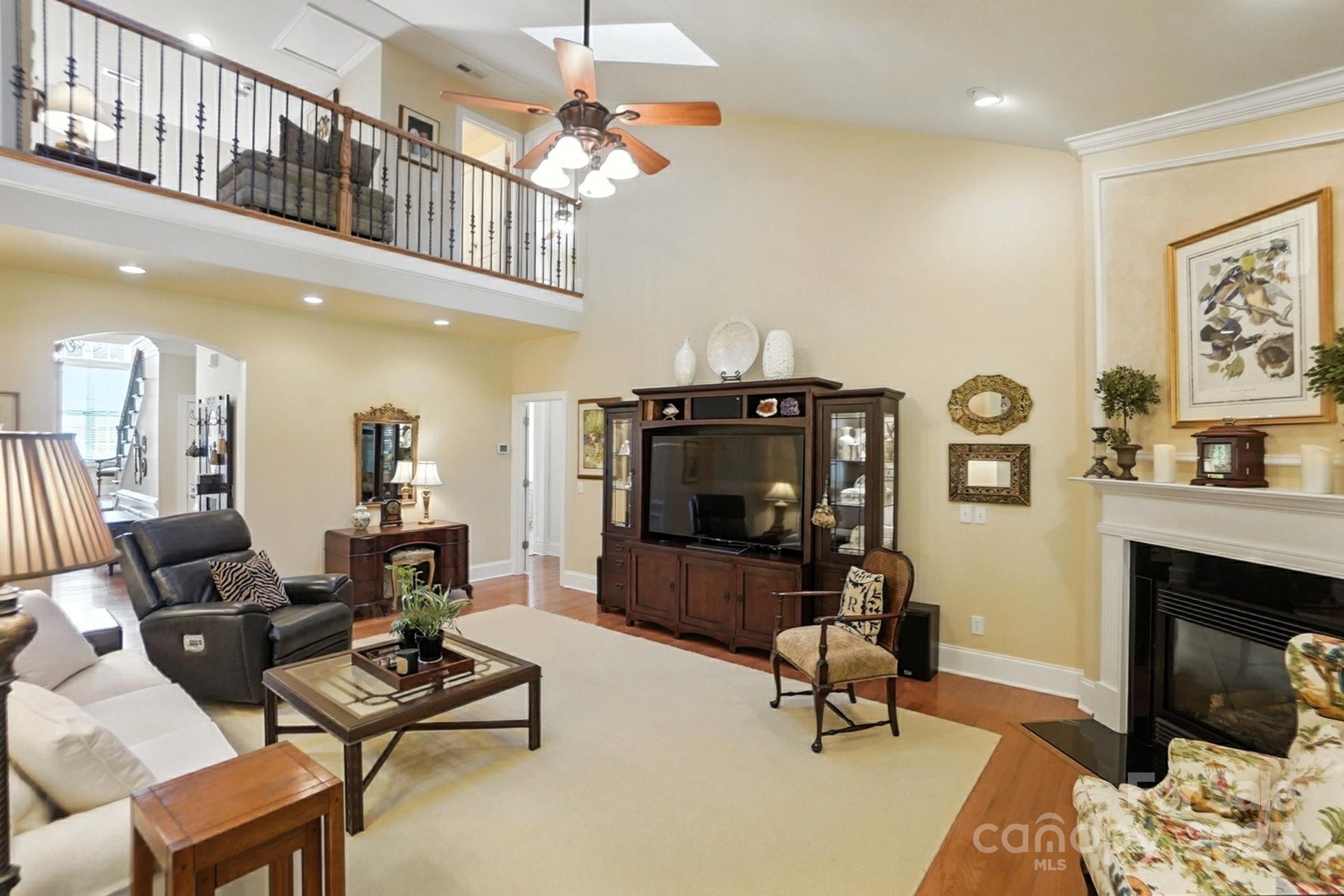 10906 Round Rock Road Charlotte, NC 28277 - Photo 8 of 45 a living room with furniture and a fireplace