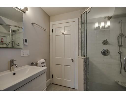 30 Whiting Road Wellesley, MA 02481 - Photo 21 of 24 a bathroom with a shower sink and mirror