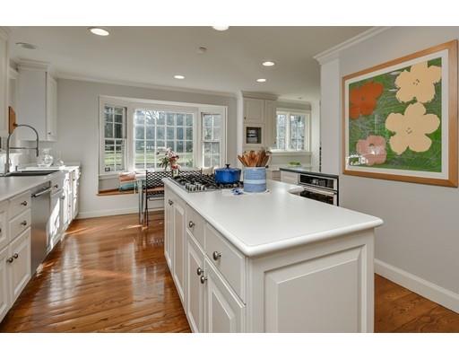 30 Whiting Road Wellesley, MA 02481 - Photo 8 of 24 a kitchen that has a lot of cabinets in it