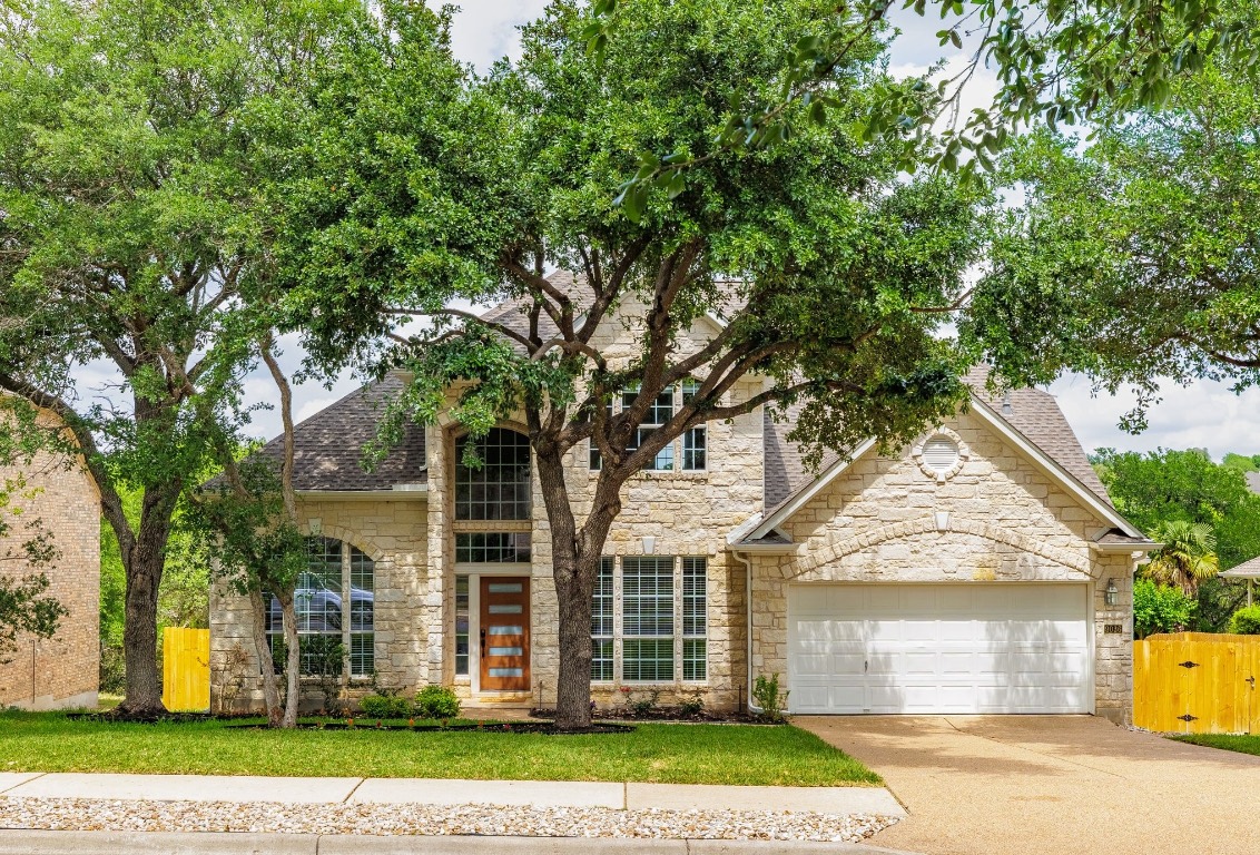 9036 Evening Primrose Path Austin, TX 78750 - Photo 1 of 1 front view of a house with a yard