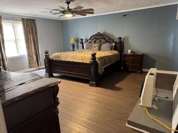 a bedroom with bed and window