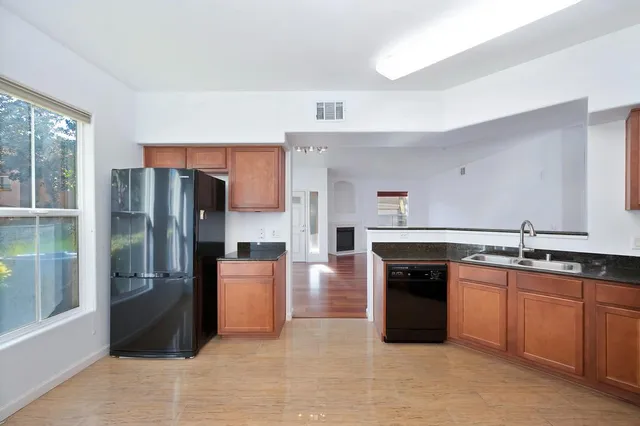 a view of a livingroom with a ceiling fan and window