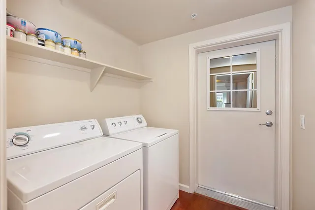 a view of a house with swimming pool and a small yard