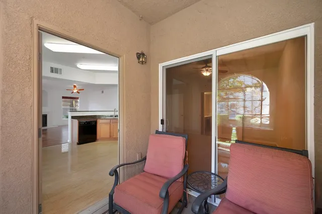 a house view with a sitting space and garden
