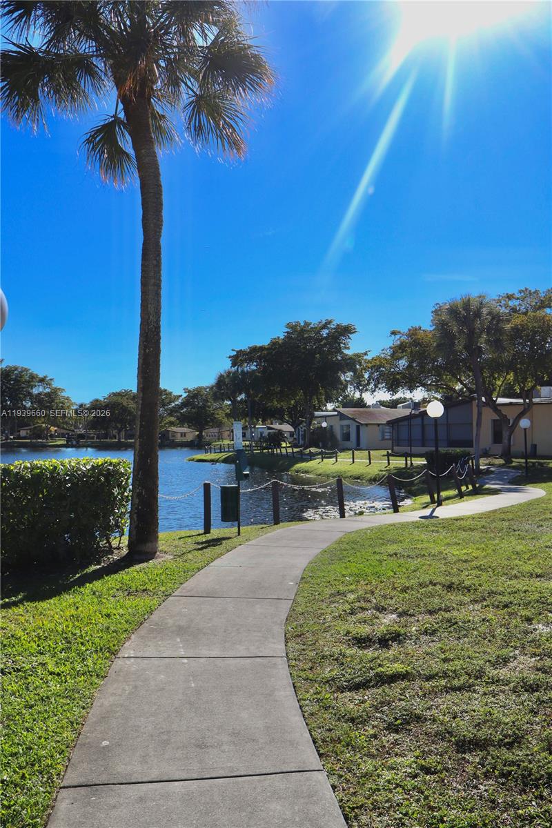 200 Ashbury Road, Unit 203 Hollywood, FL 33024 - Photo 25 of 44 Lake with Walking Path