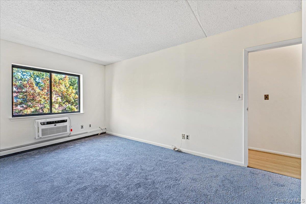 71-29 Sutton Place, Unit 3 Queens, NY 11365 - Photo 17 of 24 an empty room with windows