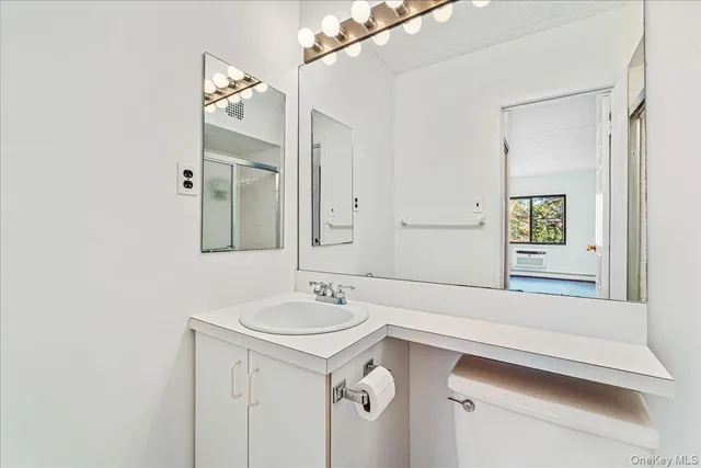 a view of a sink and mirror