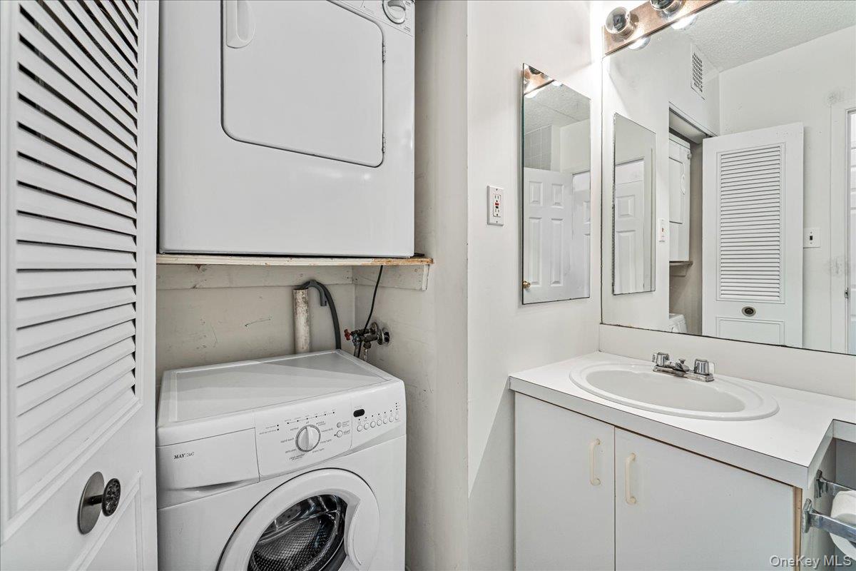 71-29 Sutton Place, Unit 3 Queens, NY 11365 - Photo 19 of 24 a utility room with dryer and washer