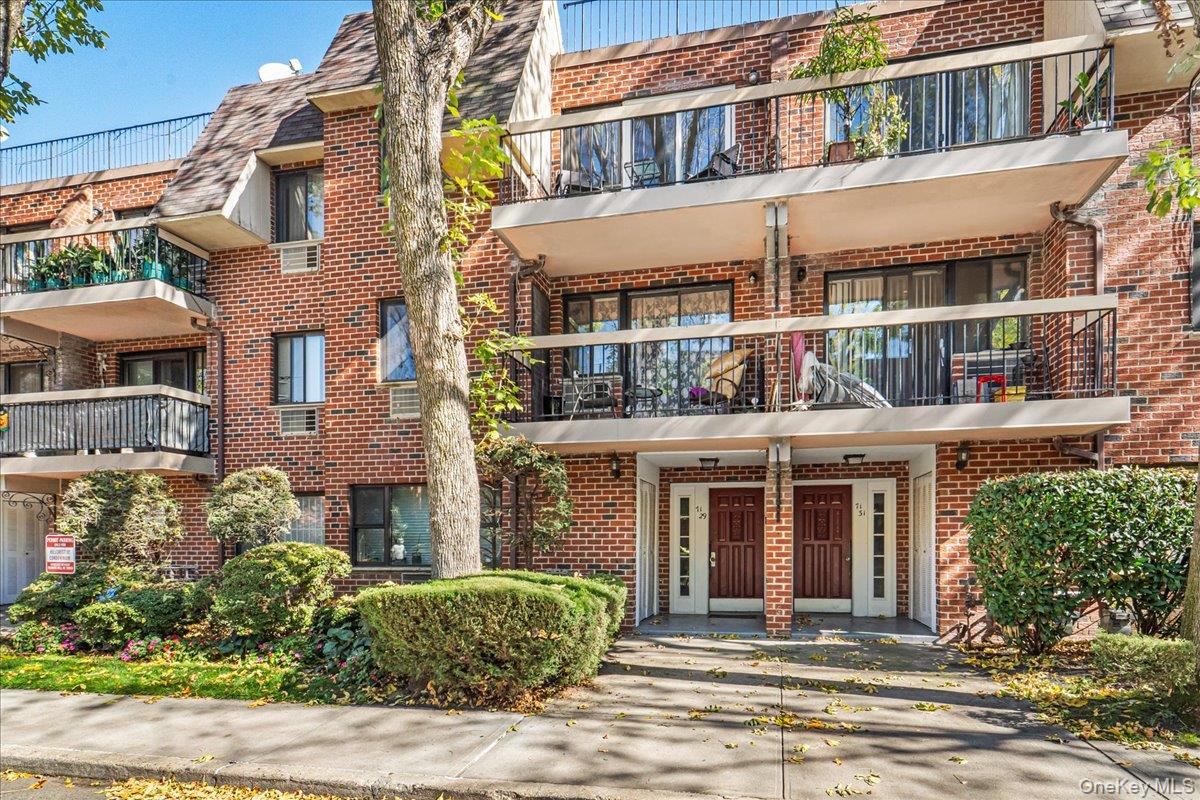 71-29 Sutton Place, Unit 3 Queens, NY 11365 - Photo 2 of 24 a front view of a building and a garden