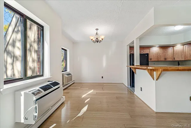 a view of a kitchen with a sink and a stove top oven