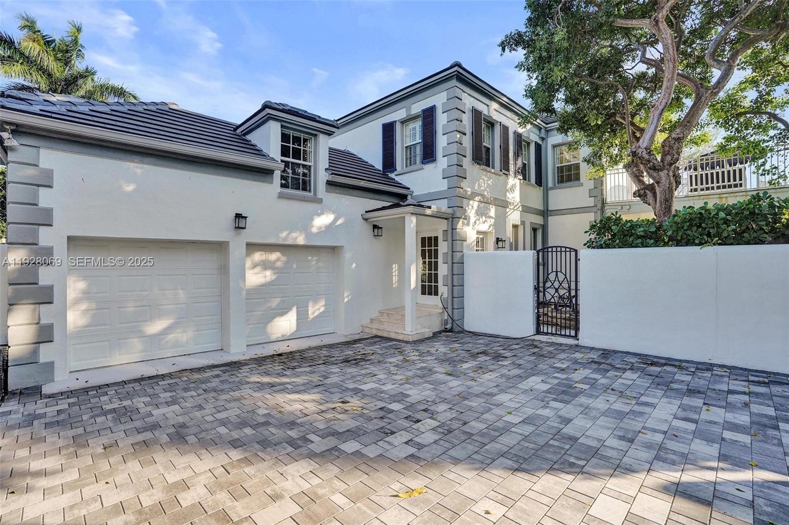 1281 Banyan Road Boca Raton, FL 33432 - Photo 26 of 69 a front view of a house with a yard
