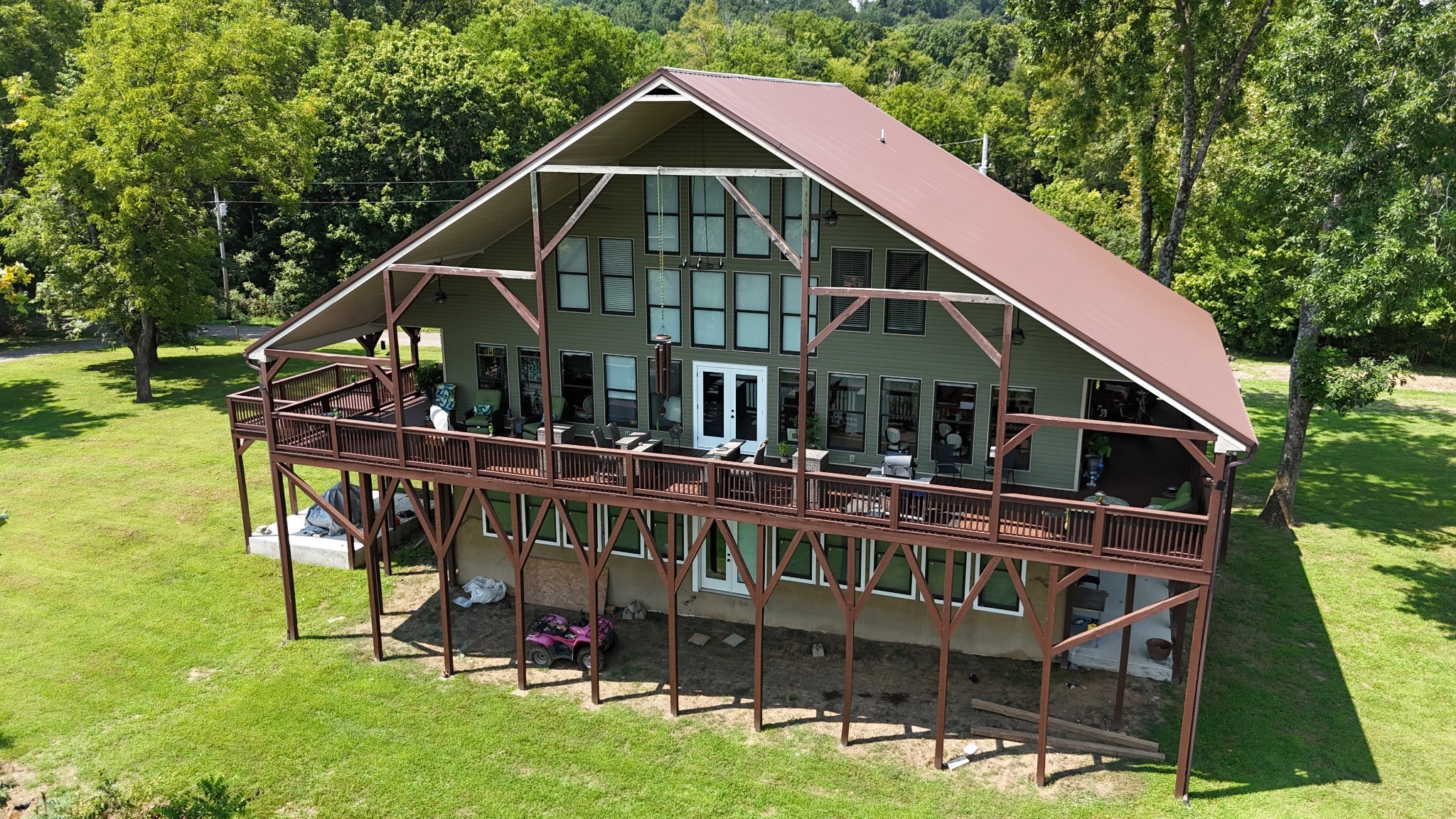 950 Sauger Road Charlotte, TN 37036 - Photo 2 of 46 a view of a house with a deck and a yard