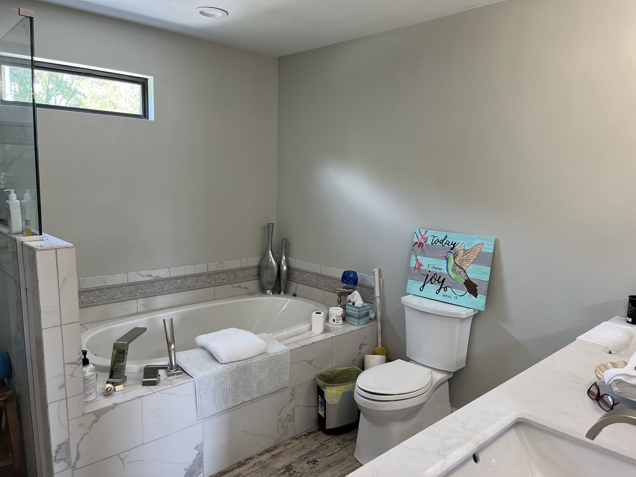 950 Sauger Road Charlotte, TN 37036 - Photo 22 of 46 a white toilet sitting next to a bathroom sink and tub