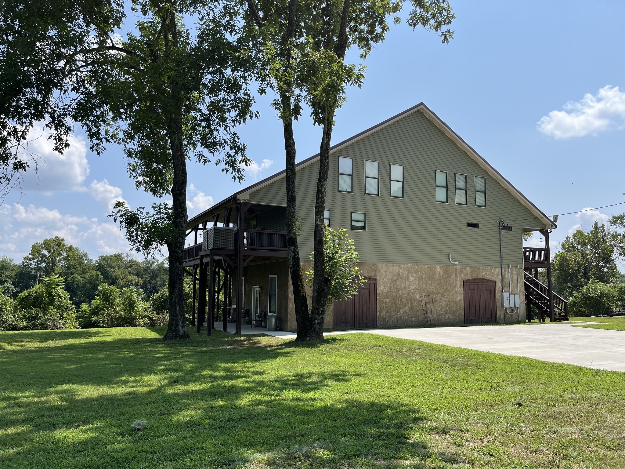 950 Sauger Road Charlotte, TN 37036 - Photo 32 of 46 a front view of a house with a yard